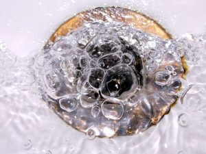 water bubbling down the drain