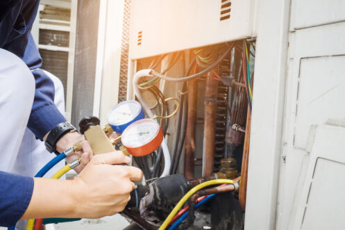 An HVAC tech checking a furnace in Sacramento